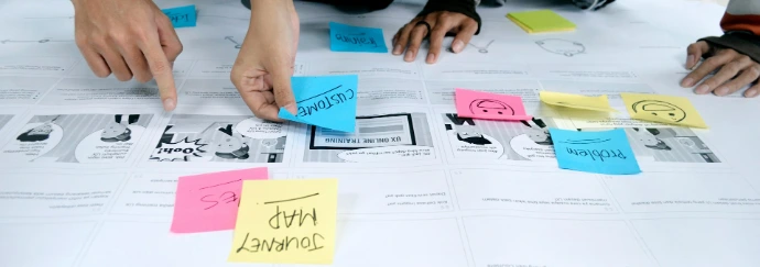 team collaborating with sticky notes